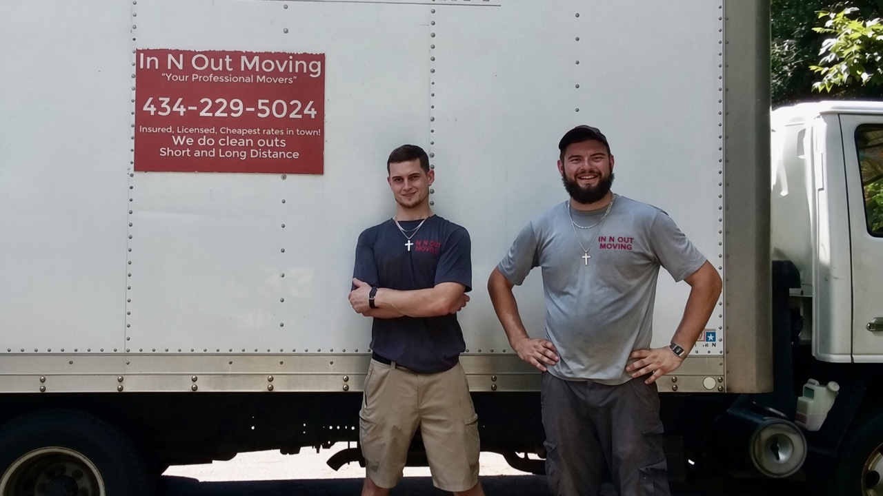 Cameron Cook and the In N Out Moving crew standing in front of their moving truck